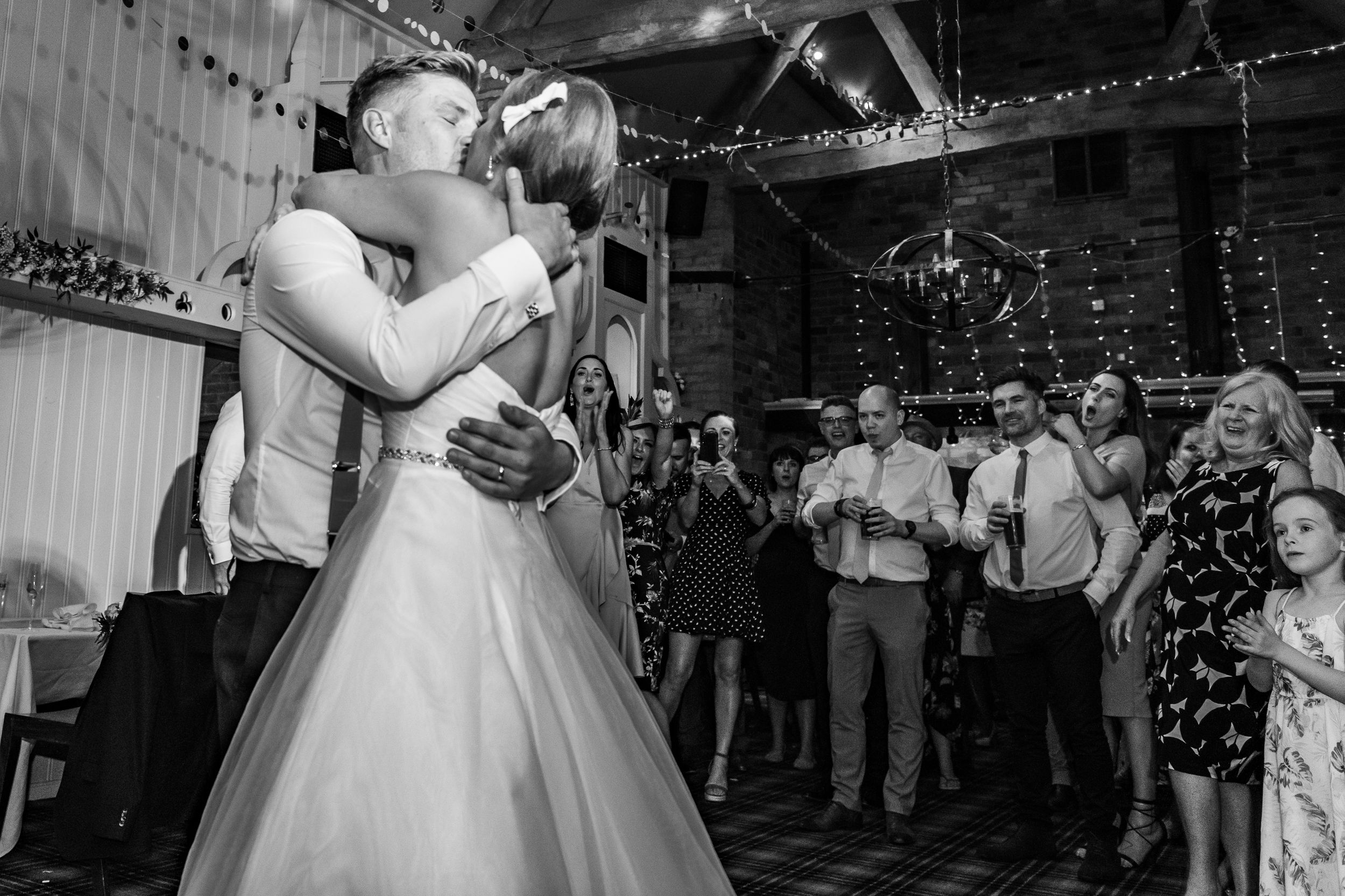bride and groom kissing on the dance floor