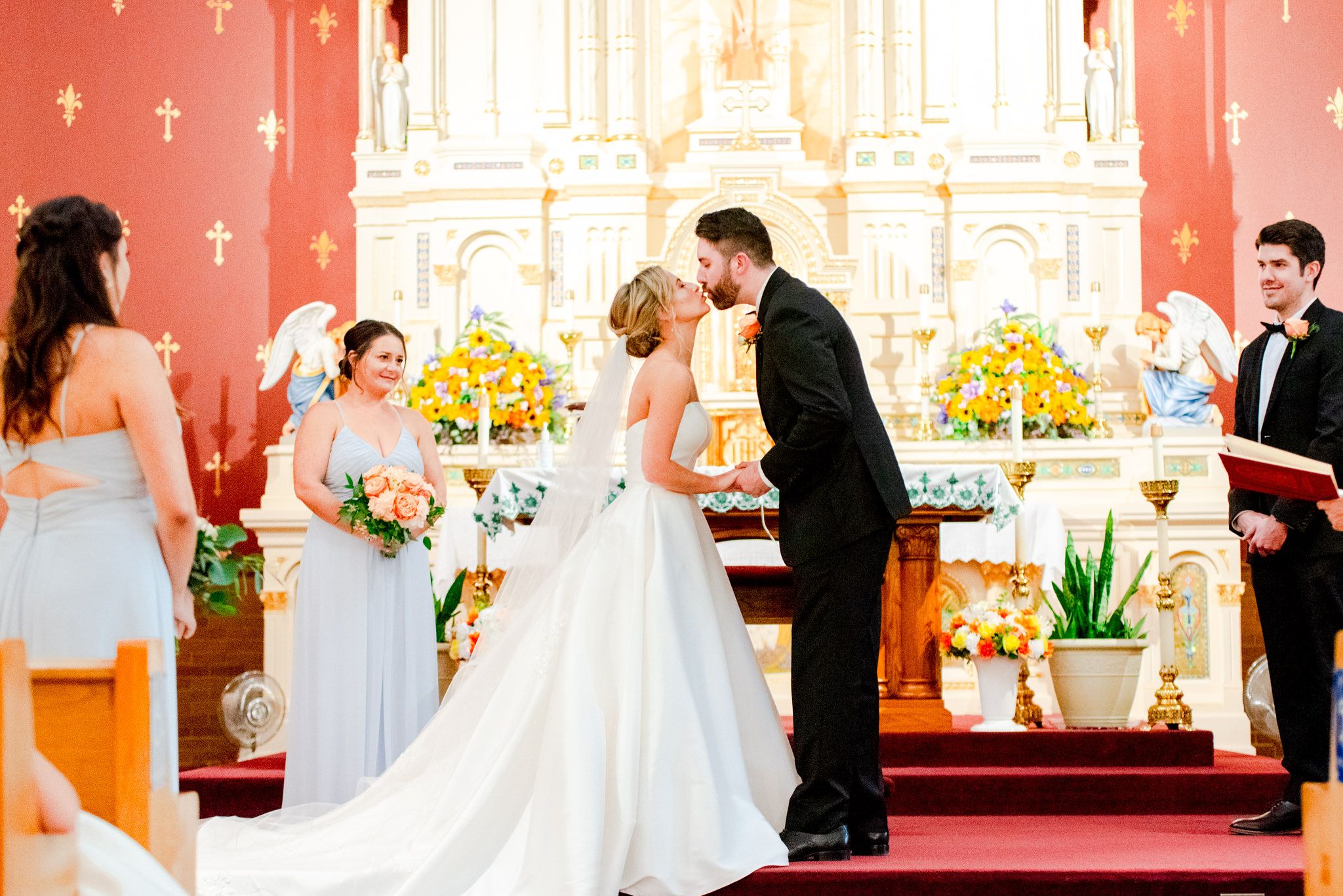 bride and groom first kiss at church ceremony in downtown STL
