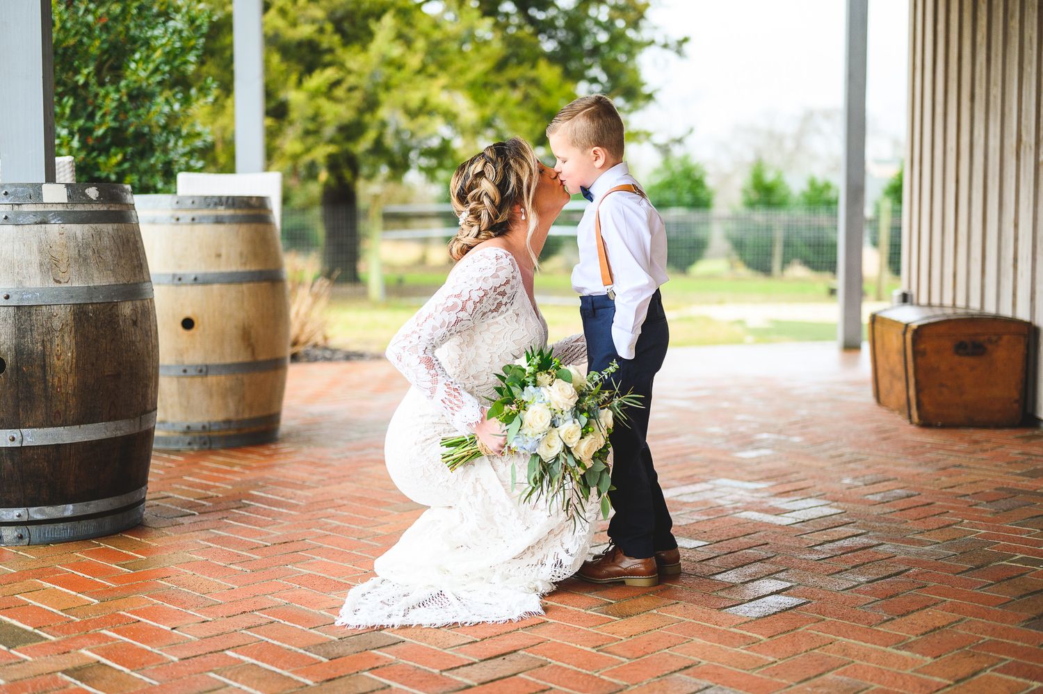 bride and son kissing at Edel Haus alpaca farm