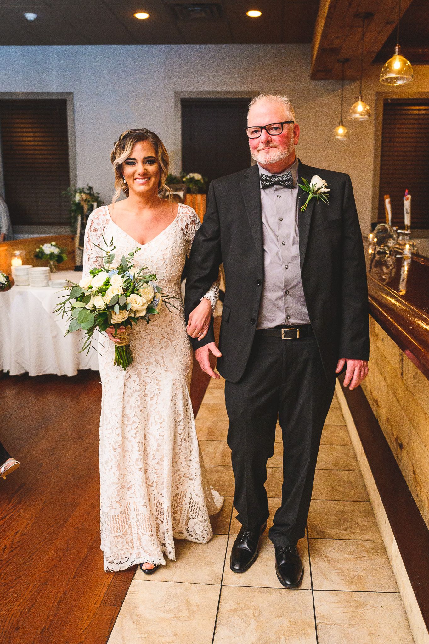 bride walking down isle at b2 bistro