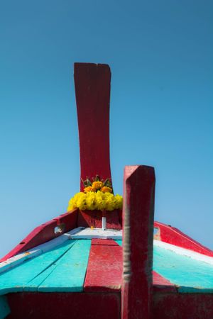 Colourful boat prow, blue sky above the Andaman sea in Thailand