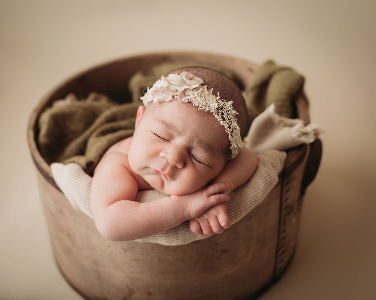 Professional newborn photo baby in a bucket