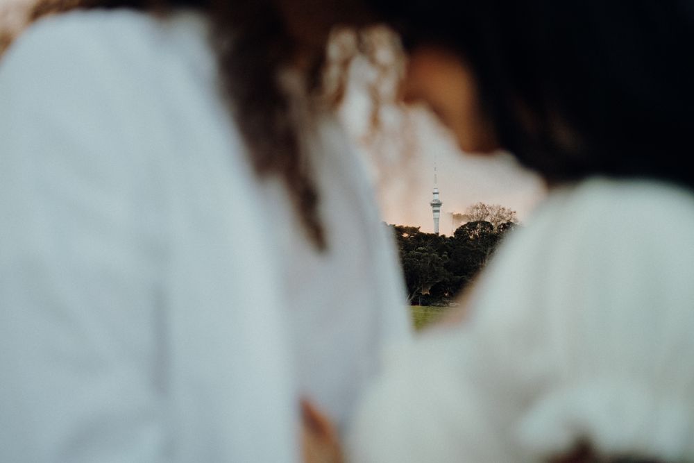 Artistic close-up shot with soft bokeh effect and white clothing.