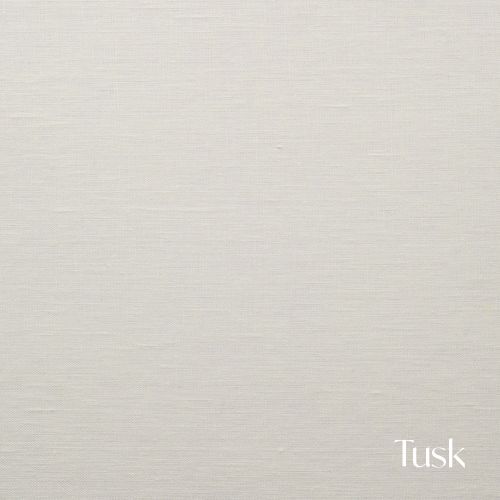 A creamy off-white fabric swatch with subtle texture labeled as Tusk.