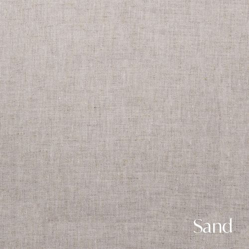 Light beige linen fabric sample labeled Sand featuring natural woven texture.