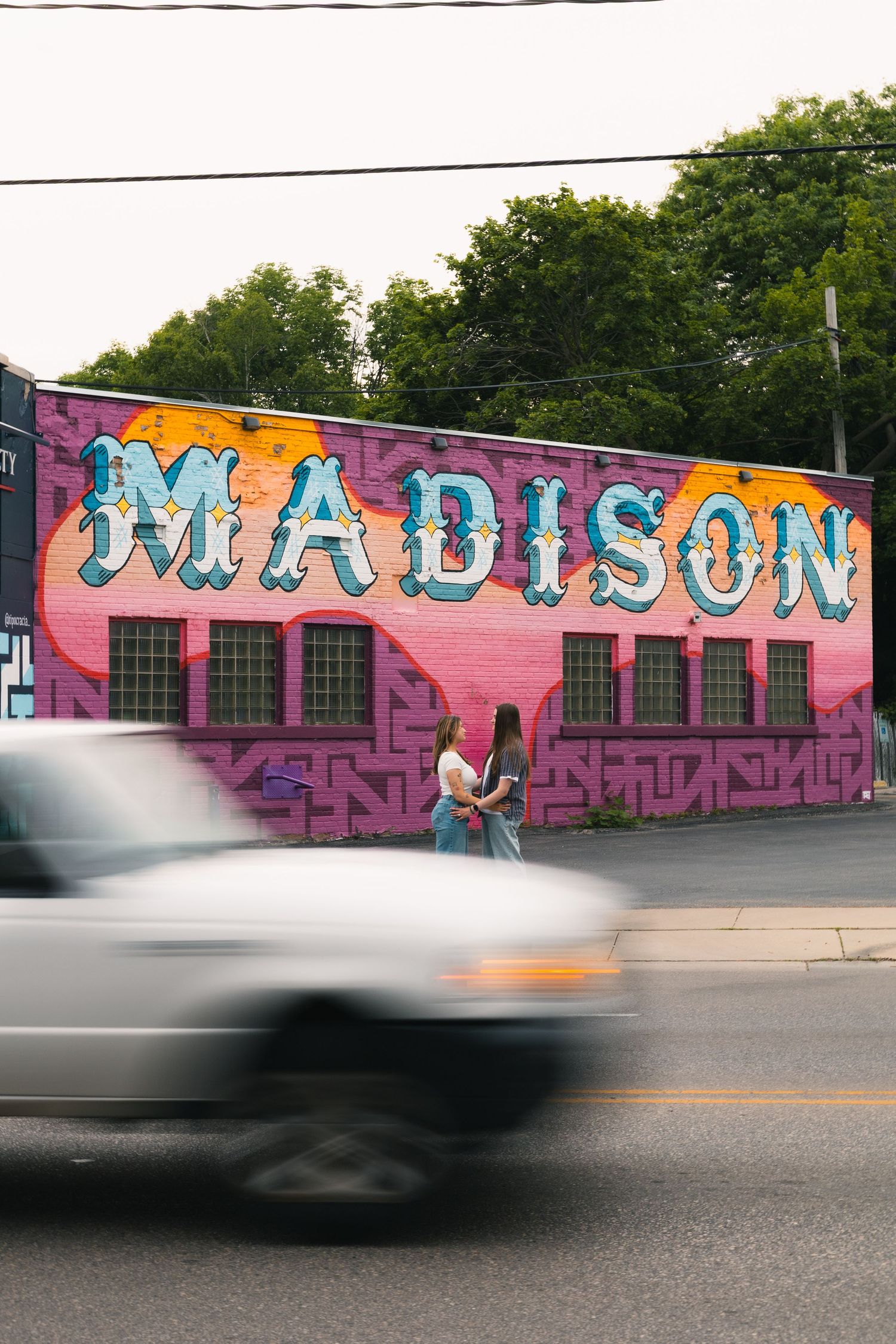 madison wi couples engagement photographer monroe street mural triangulador lauer realty group lgbtq colorful unique photos wisconsin urban