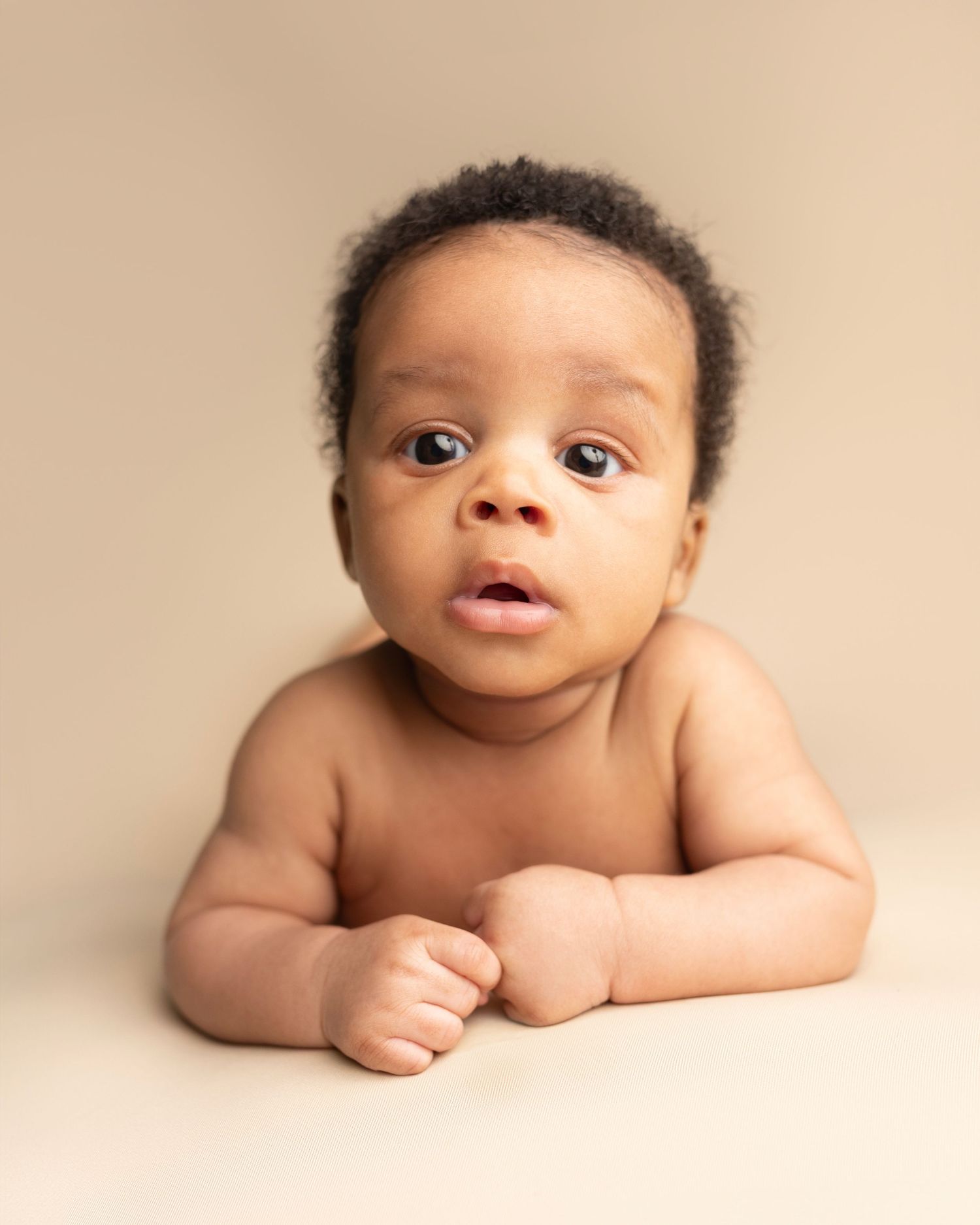 Jesse wide awake during tummy time. I’m so grateful Raven trusted me to photograph her sweet boy. Jesse’s images are filled with warmth, per