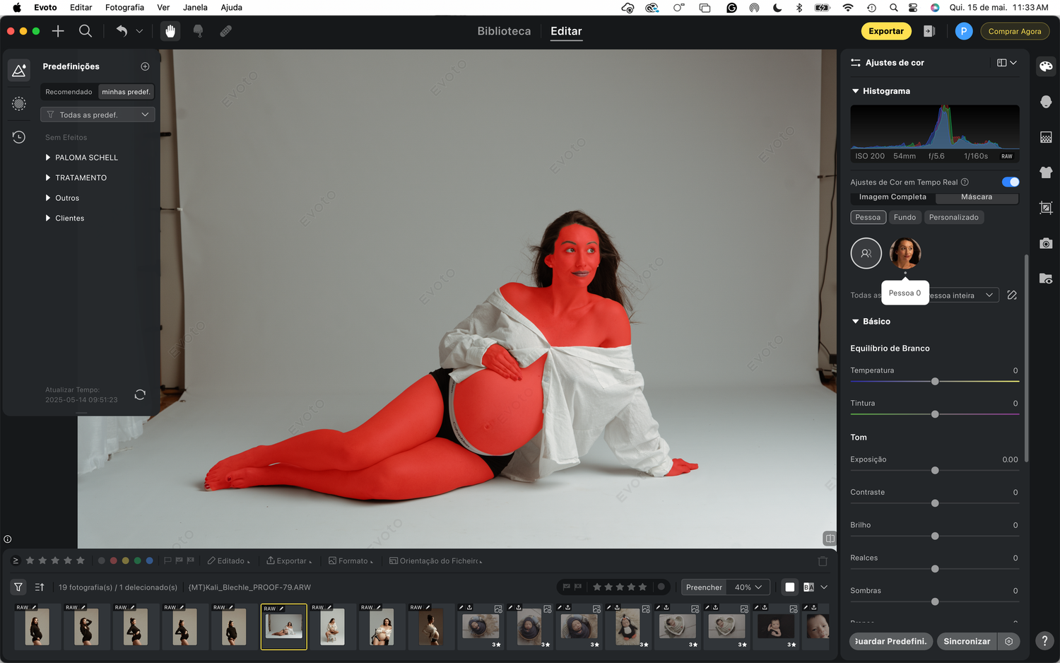A side-lying figure in a white robe poses for an artistic photo in a photography editing software window.