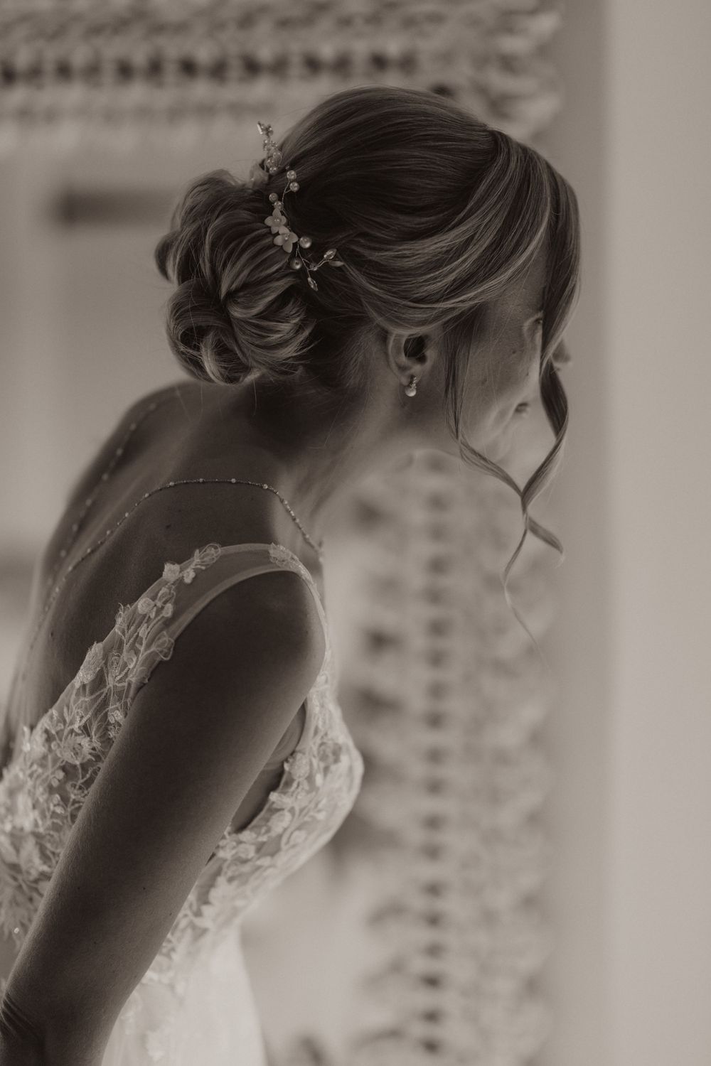 Close-up details of delicate lace and beadwork on a wedding dress at Crockwell Farm wedding