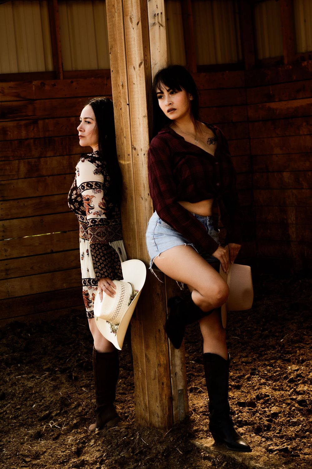 Rustic barn interior scene with warm lighting and wooden beams.