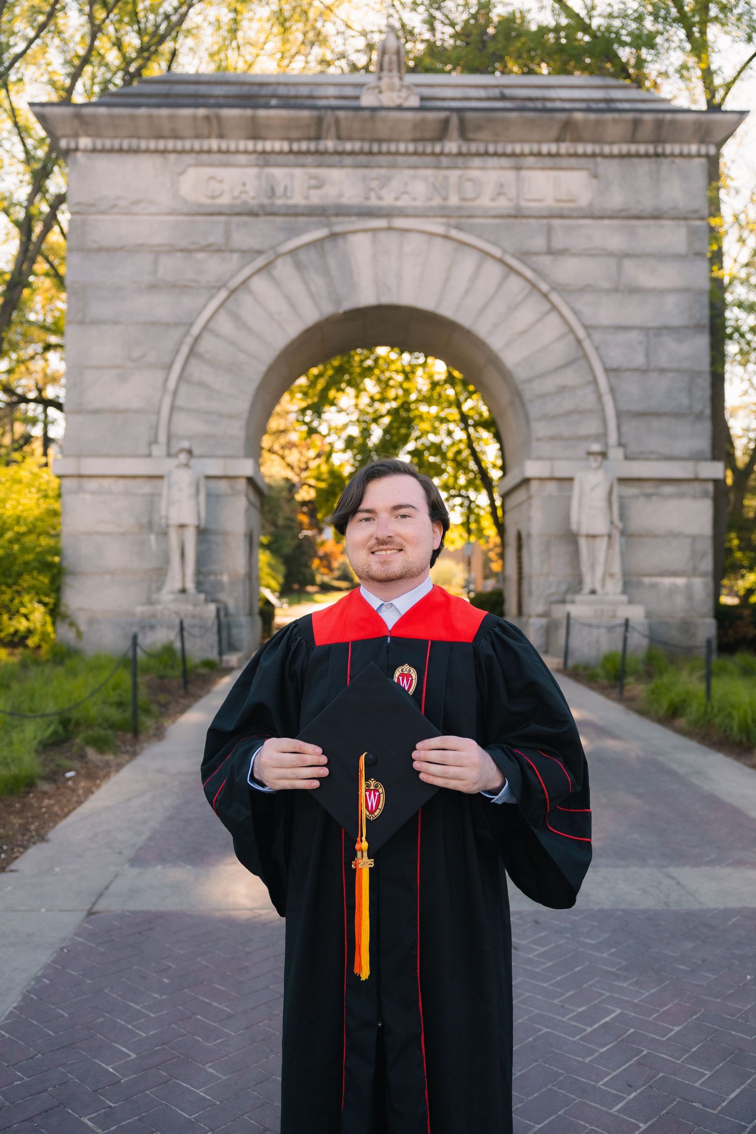uw madison university of wisconsin alumni graduation graduates professional photos camp randall arch football stadium badgers cap and gown
