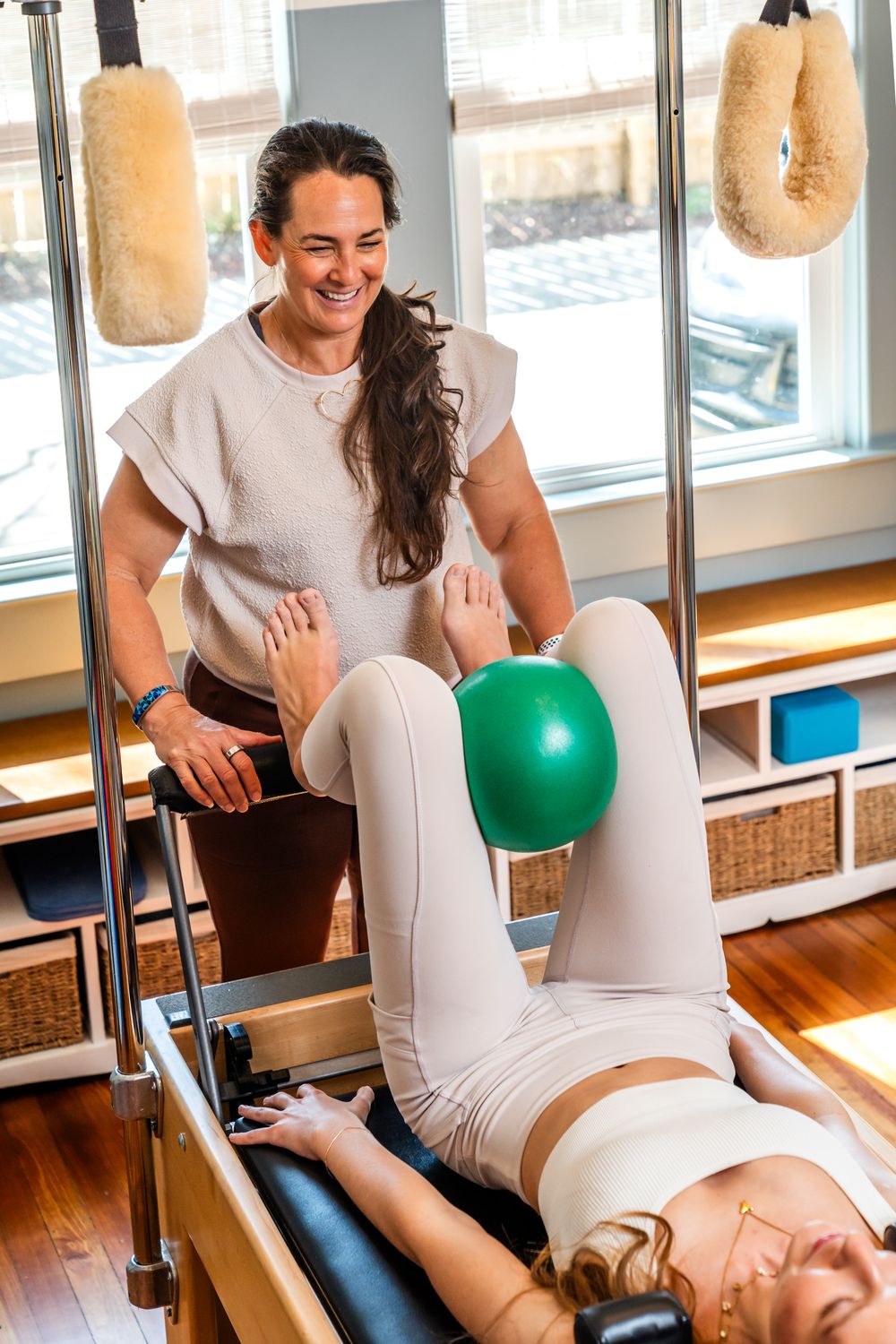 Physical therapy session showing treatment techniques with exercise ball and padded equipment.