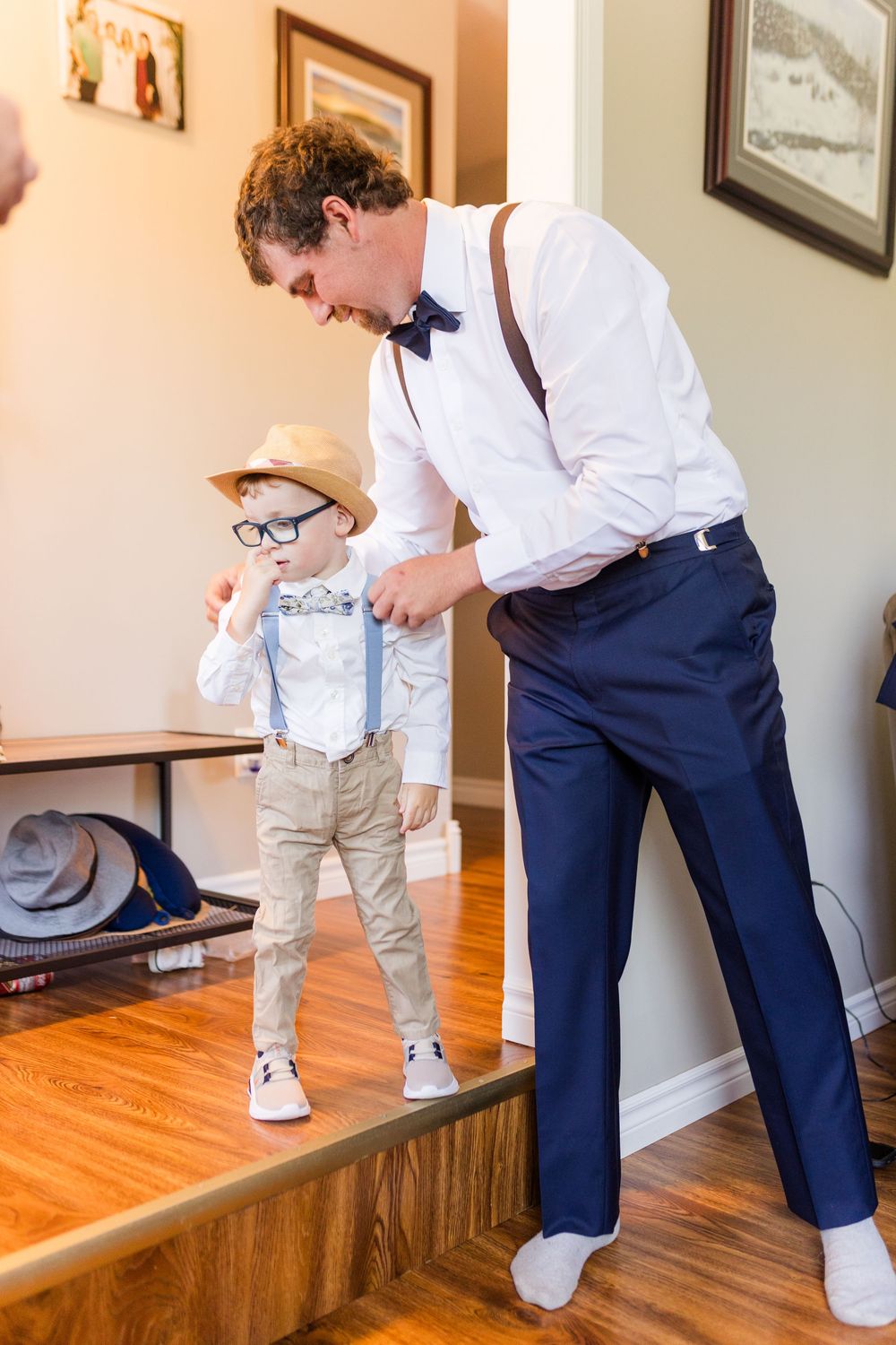 Four sequential photos show someone helping a toddler put on white shoes while sitting on a wooden bench.