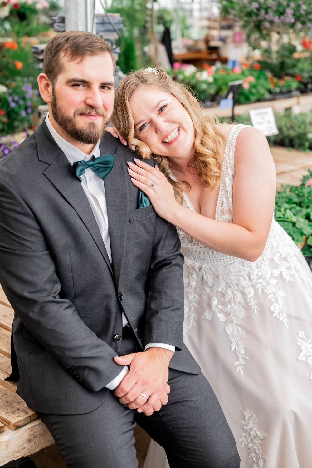 Candid moments of a couple sitting together and laughing during an outdoor wedding photoshoot in a garden setting.