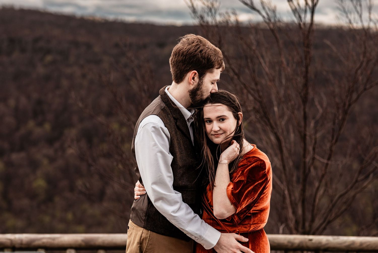 WV engaged couple embrace at Coopers Rock State Park