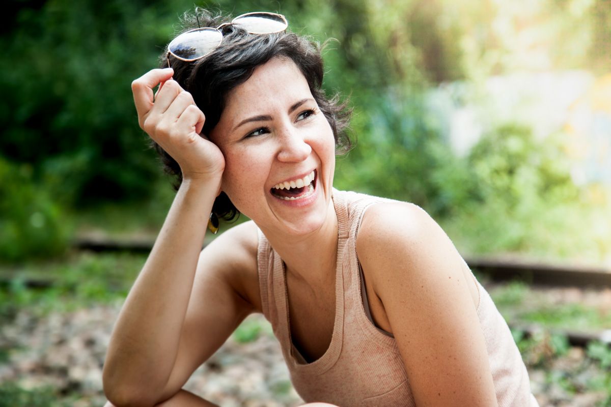 A joyful moment captured outdoors in natural lighting.