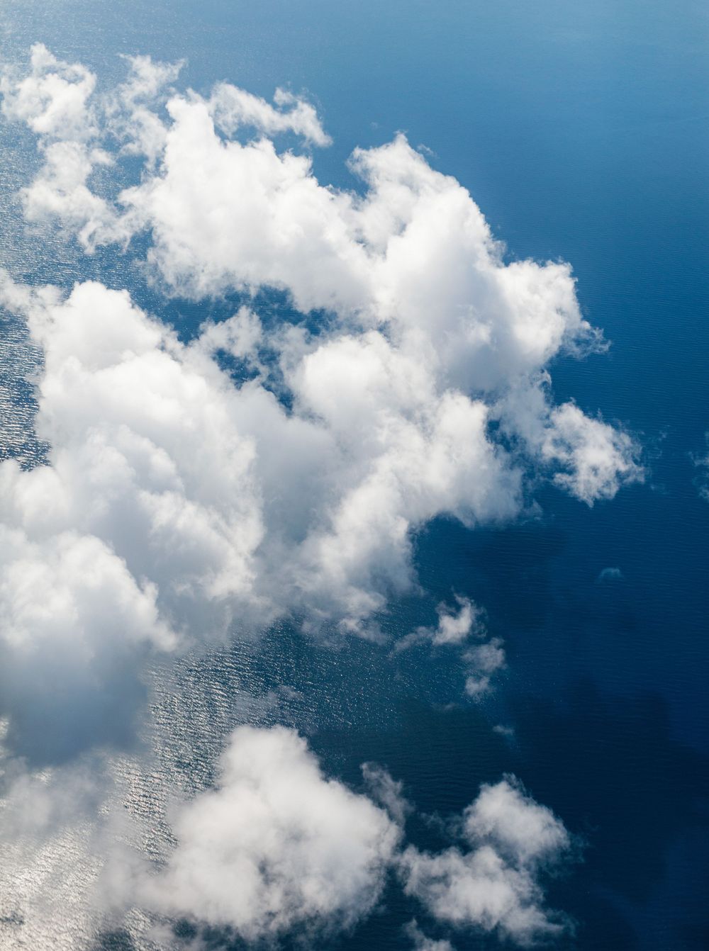 Ocean seen from above as airplane flies over the Philippines.