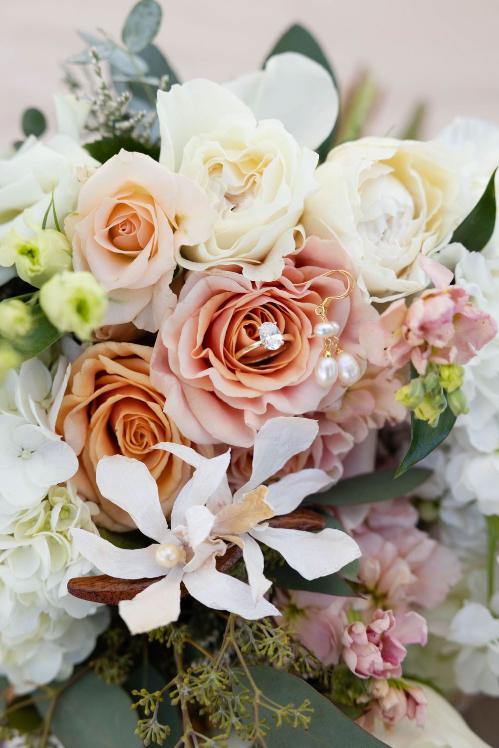 Wedding detail shot with ring in bouquet at lakeside pavilion in chico northern california wedding photograper