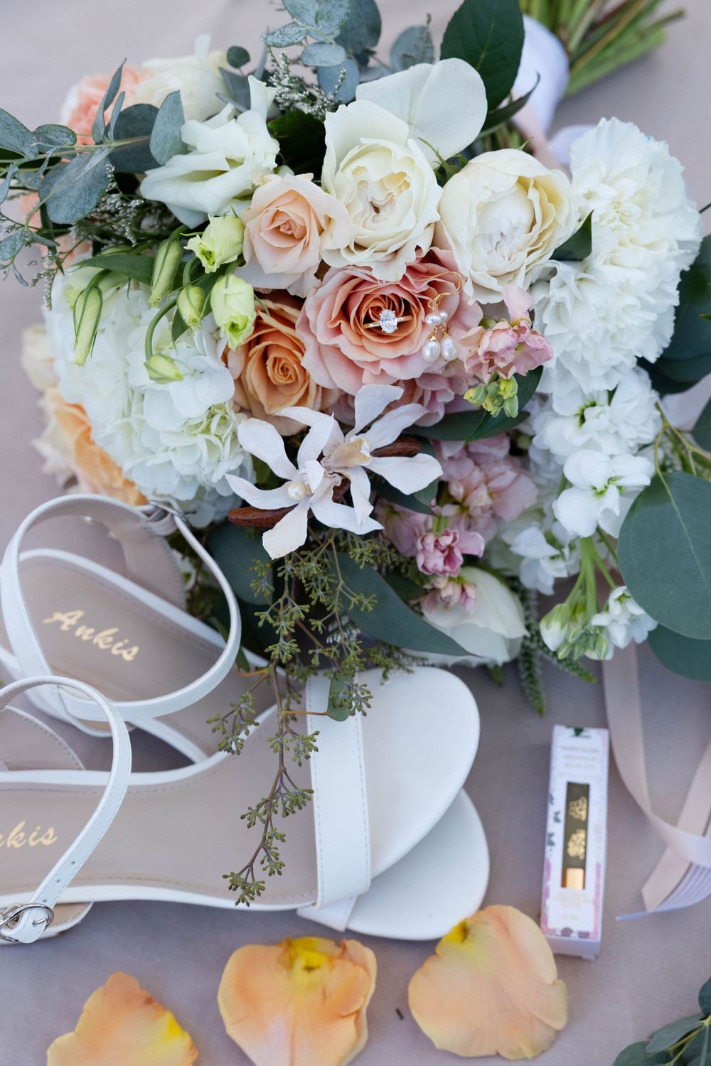 lay flat detail with bouquet, shoes and perfume at lakeside pavilion in chico northern california wedding photographer