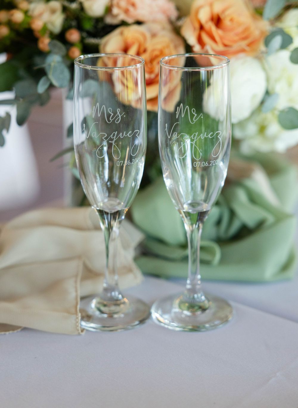 Bride and Groom custom champagne glasses at lakeside pavilion in chico northern california wedding photographer