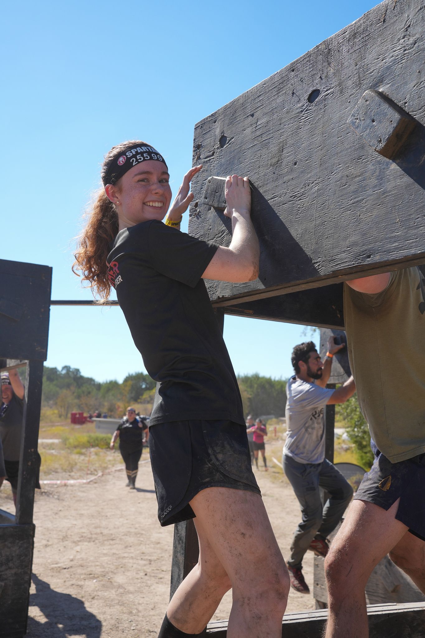 Participant at the Spartan Race in Dallas, Texas, completing an obstacle with courage and focus.