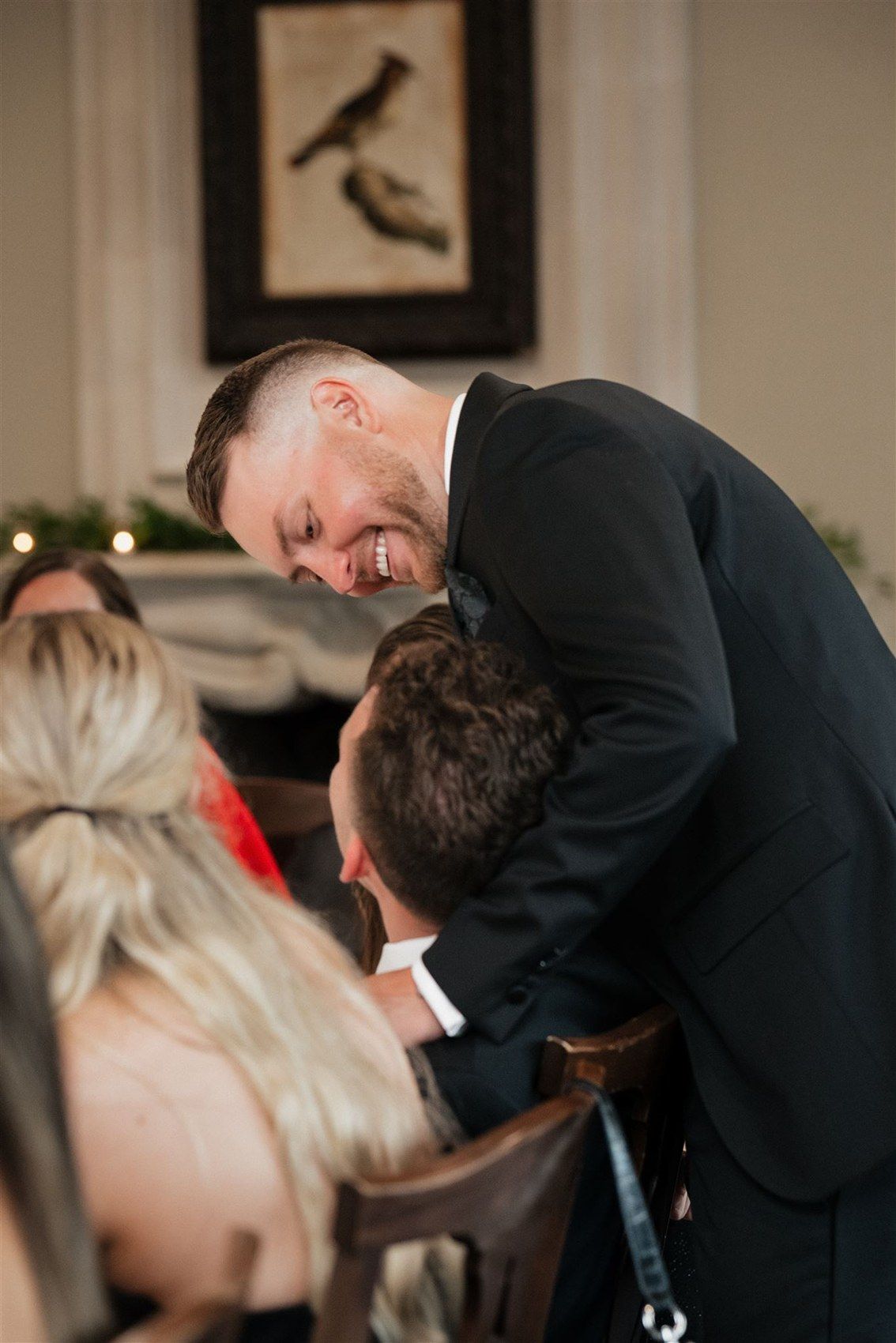 A romantic moment captured at a wedding reception as the couple shares a loving dip and kiss on the dance floor.
