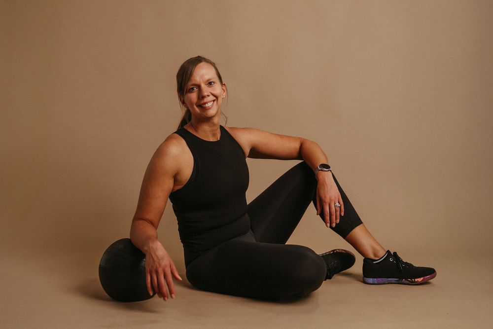 Someone in black loungewear poses for multiple relaxed shots against a neutral backdrop.