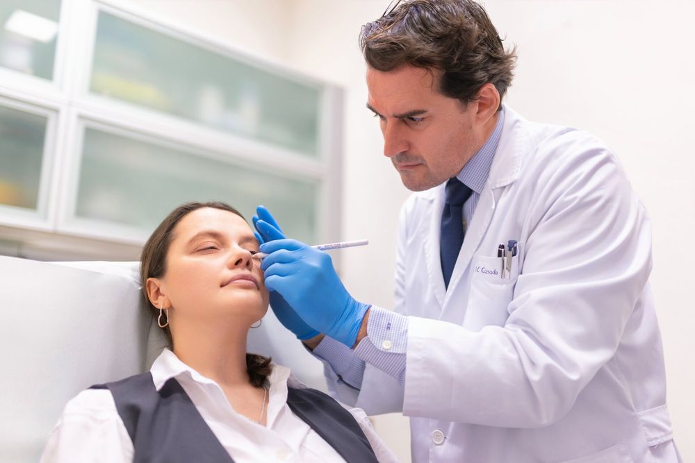 A medical examination being performed in a clinical setting with professional equipment.