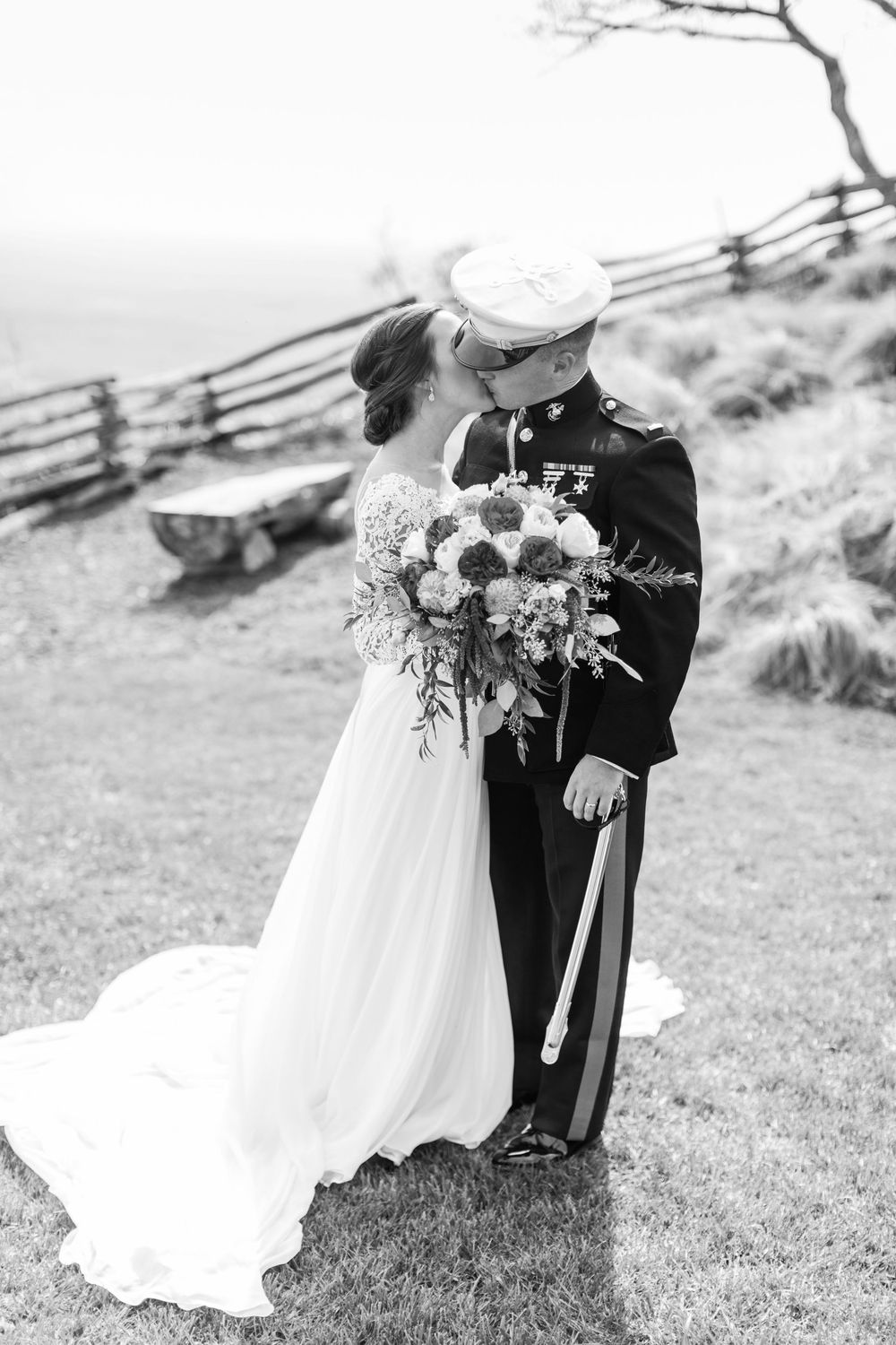 Military service member in dress uniform and bride sharing an intimate moment at Cliffs at Glassy Chapel.