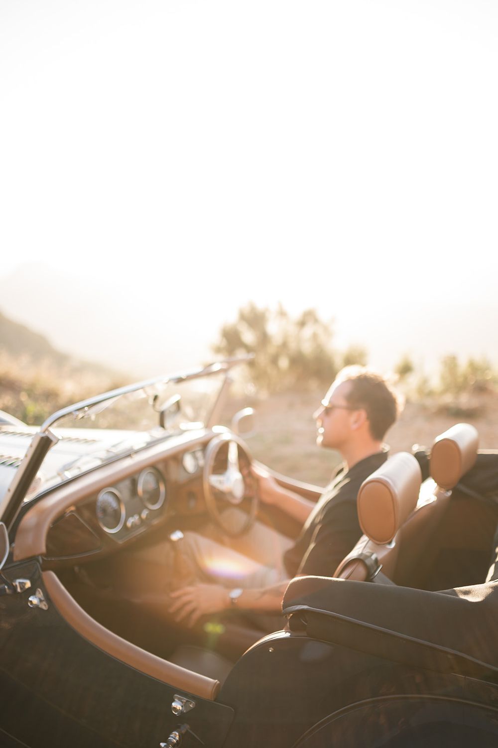 Intentional Franschhoek, Cape Town engagement session capturing soulful, effortless love with warm spring light, fun and a old school car.