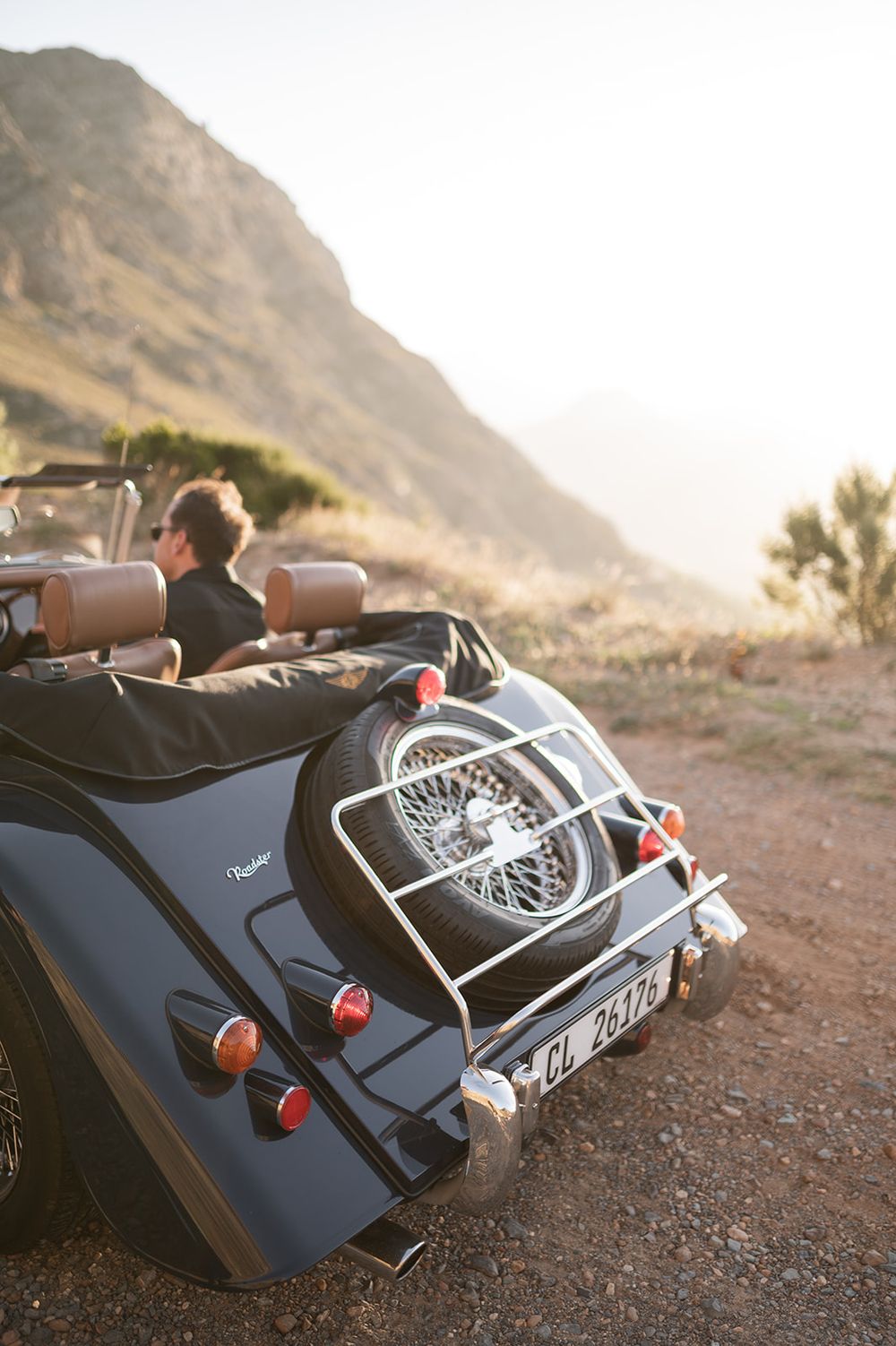 Intentional Franschhoek, Cape Town engagement session capturing soulful, effortless love with warm spring light, fun and a old school car.
