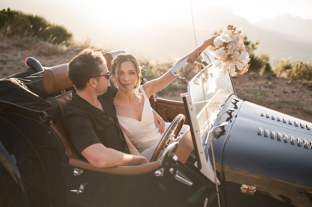 Intentional Franschhoek, Cape Town engagement session capturing soulful, effortless love with warm spring light, fun and a old school car.