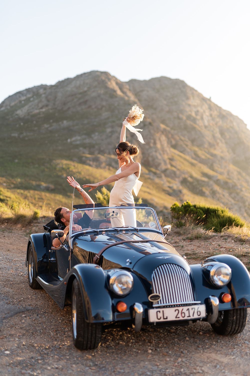 Intentional Franschhoek, Cape Town engagement session capturing soulful, effortless love with warm spring light, fun and a old school car.