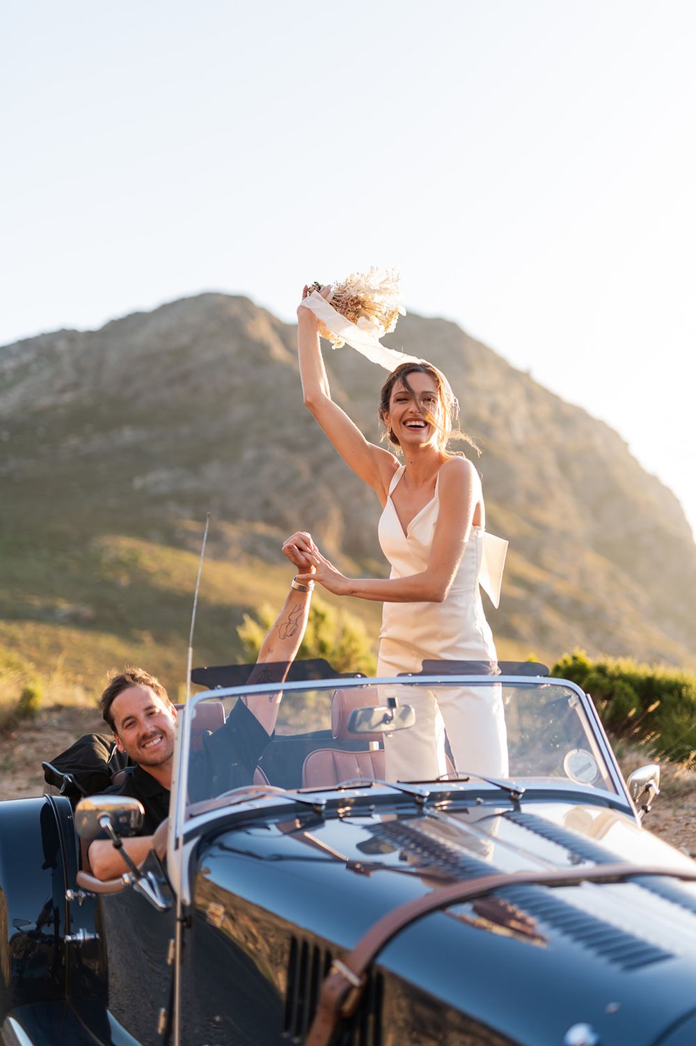 Intentional Franschhoek, Cape Town engagement session capturing soulful, effortless love with warm spring light, fun and a old school car.