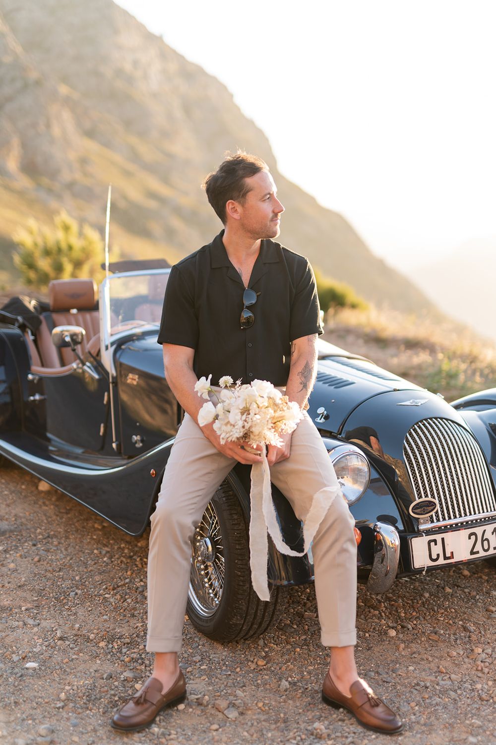 Intentional Franschhoek, Cape Town engagement session capturing soulful, effortless love with warm spring light, fun and a old school car.