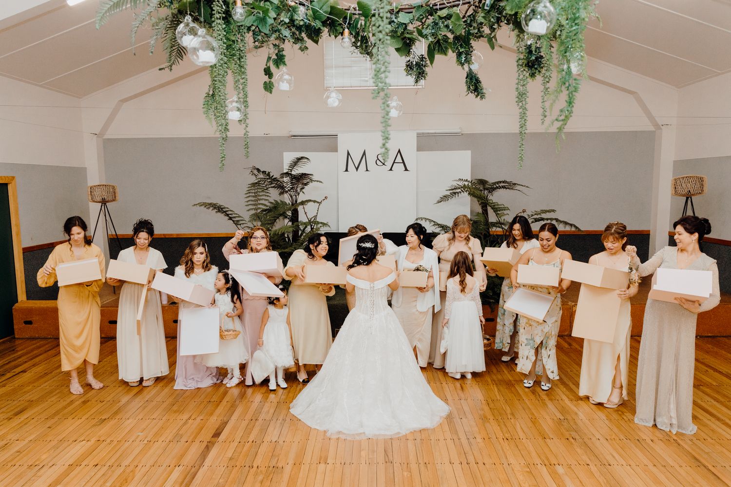 Bride gift giving to her bridal party in Ararimu Hall. Captured by Apertured Media-Auckland Wedding Photographer