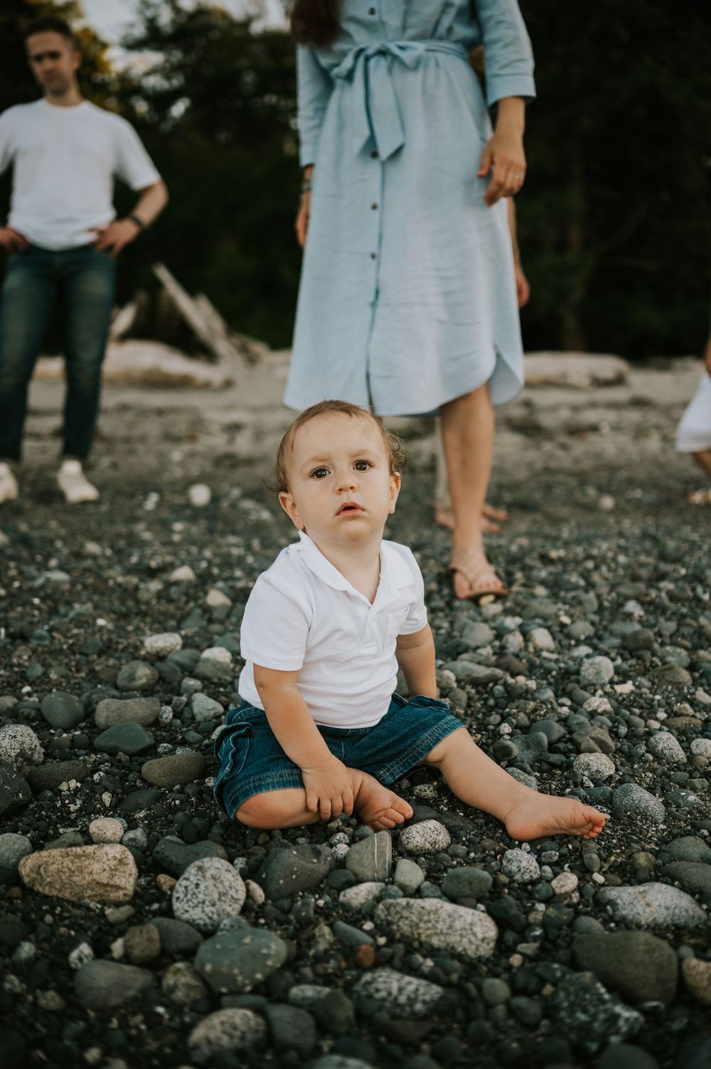 Comox Valley family photographer photoshoot of baby sitting in rocks Kye Bay Beach Portraits taken by photographer Soulfull Photographs