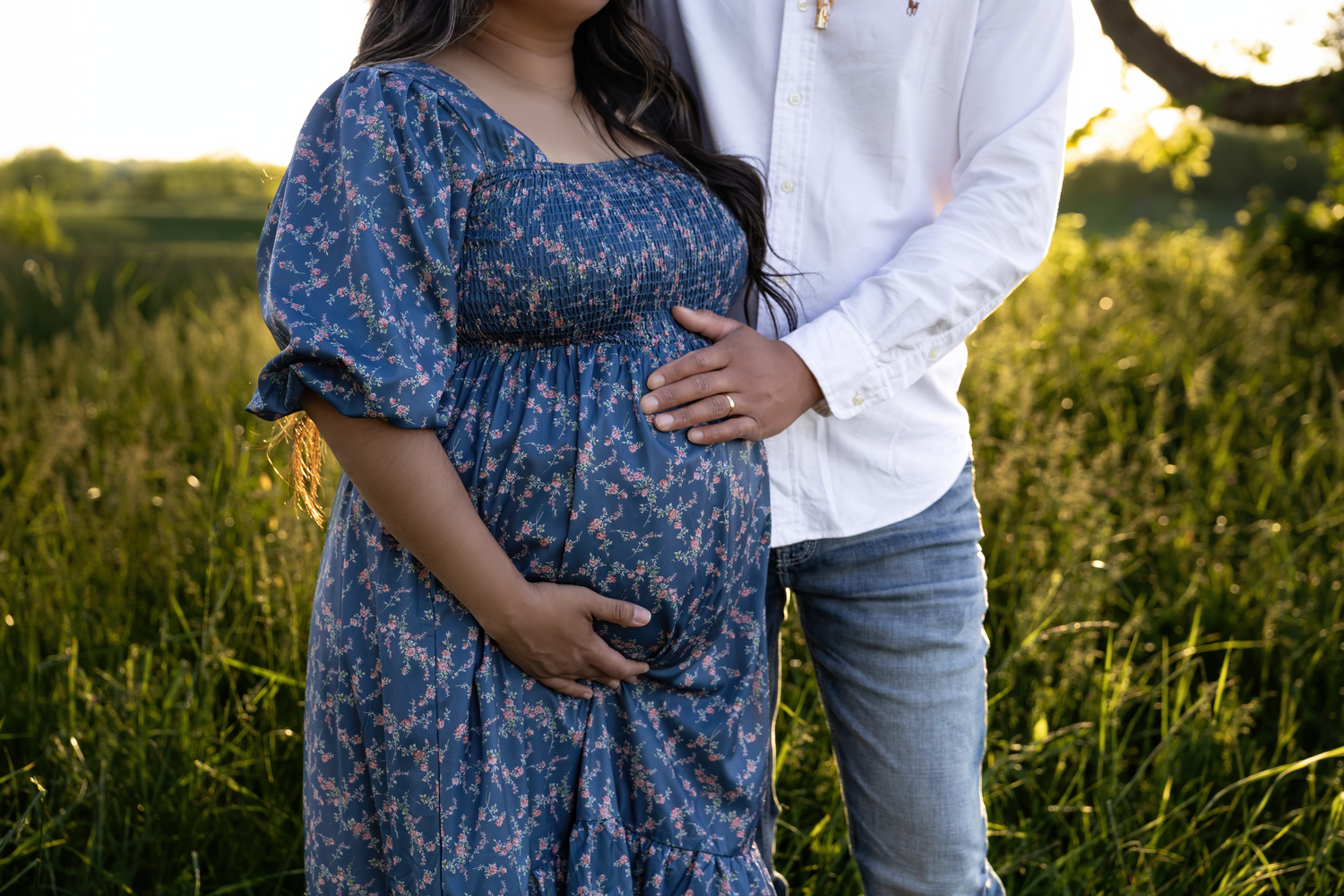 A golden hour maternity session in the Kentucky fields capturing a growing family’s love as they await their second baby boy