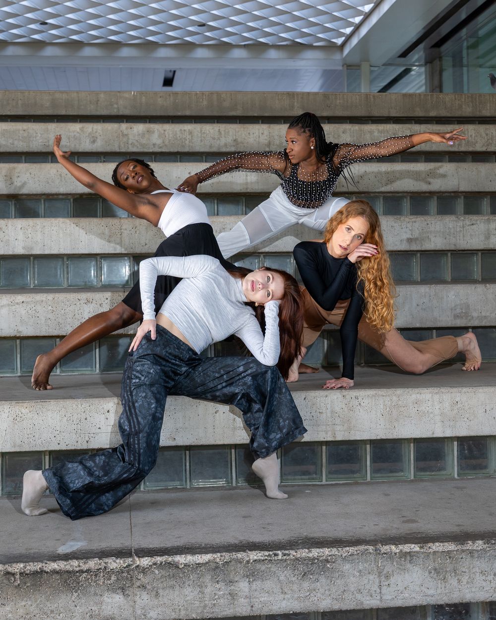 A group of female professional dancers hits a dramatic dance pose outdoors in Phx, Arizona