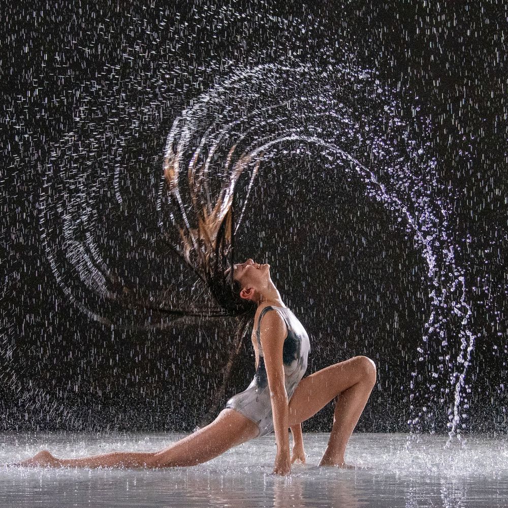 A high school girl, who dances, hits a dramatic pose in Chandler, Arizona by flipping water through her hair