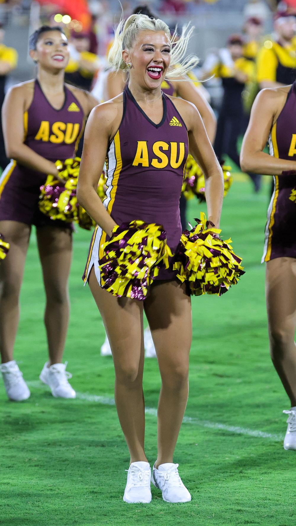 An ASU female college student, as part of the dance team, hits a dramatic pose in Tempe, Arizona