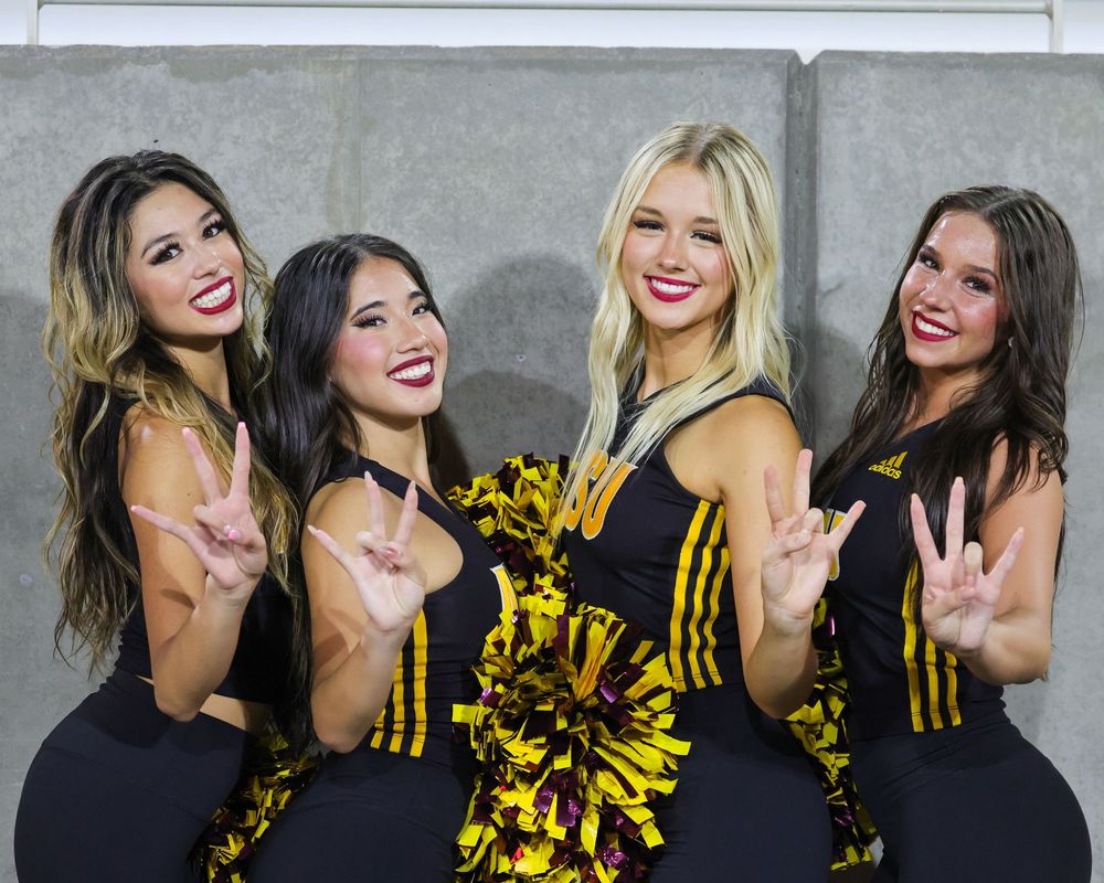 An ASU female college student, as part of the dance team, hits a dramatic pose in Tempe, Arizona