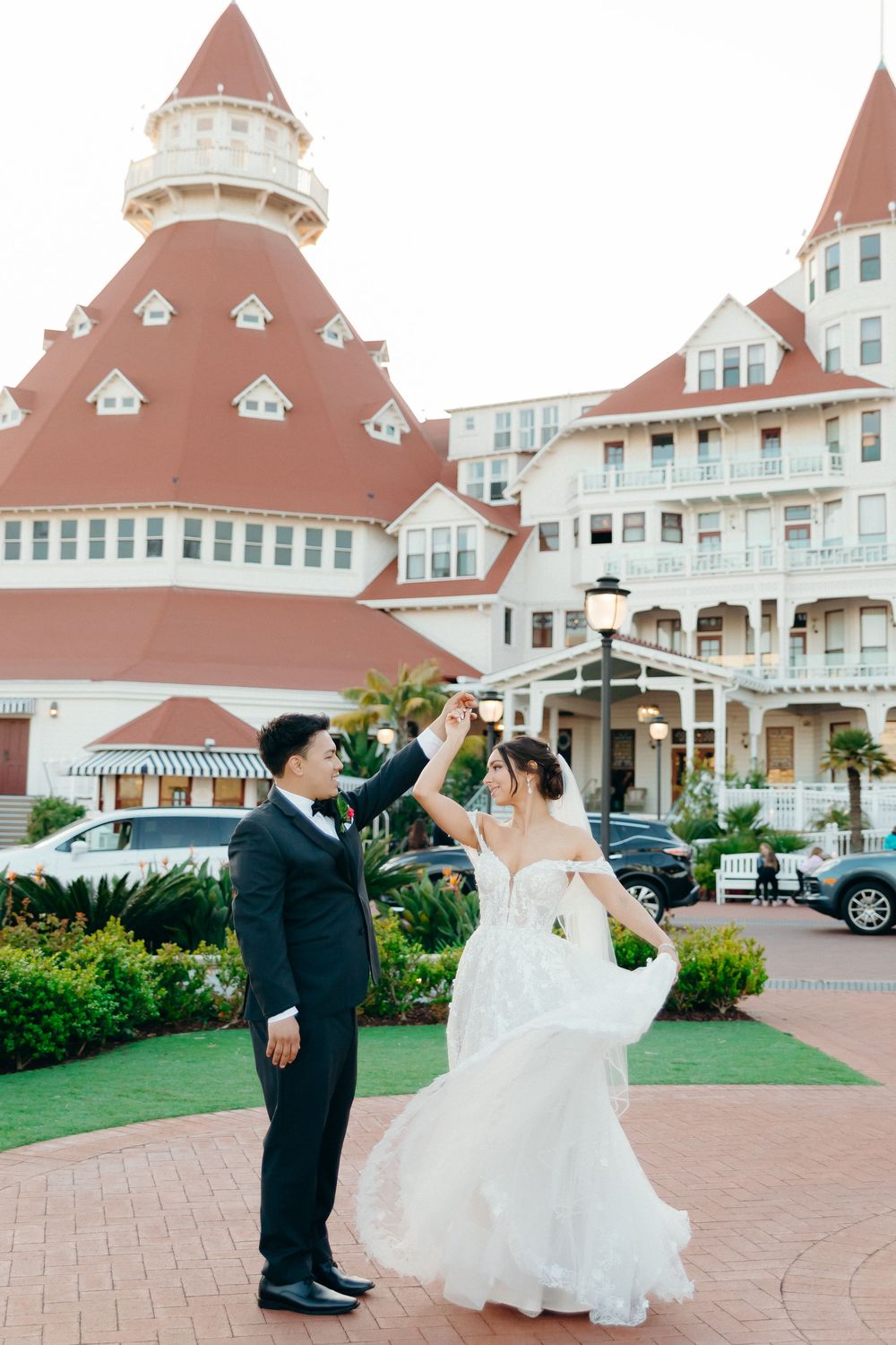 A romantic wedding dance moment in front of the iconic Hotel del Coronado in San Diego.