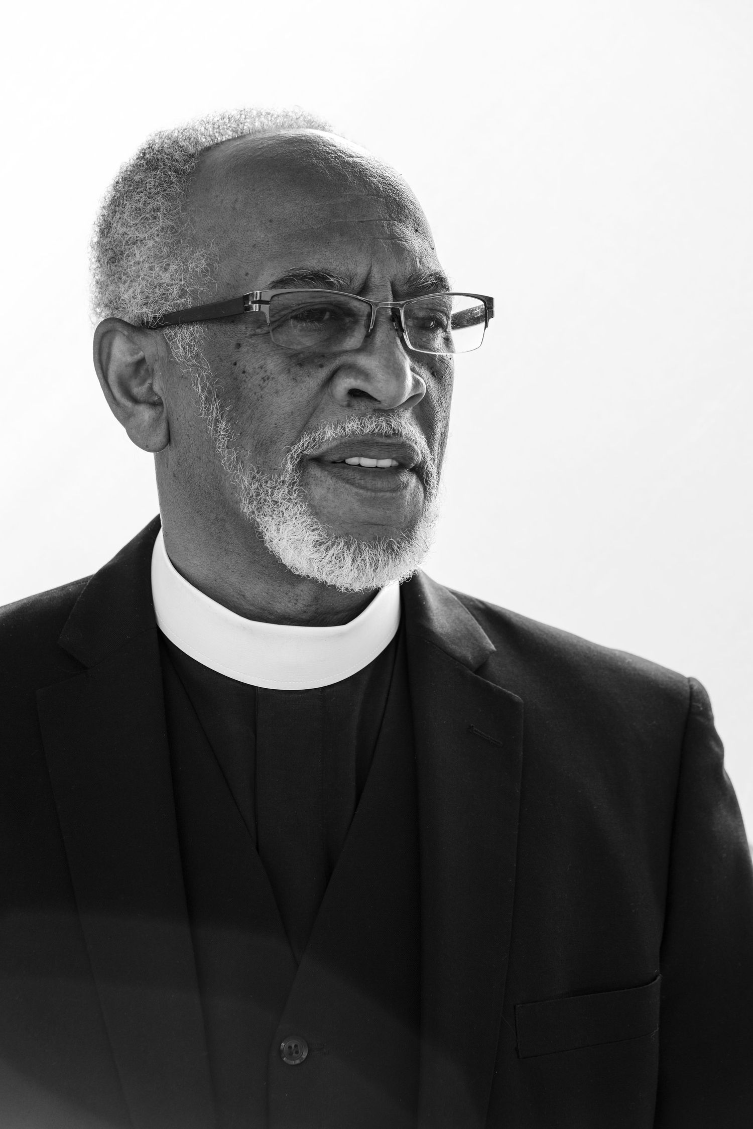 Four sequential images showing someone in a suit organizing items on a brown leather couch in a church or chapel setting.