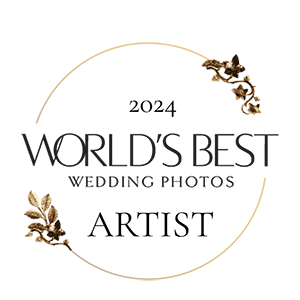 Elegant gold circular logo design for World's Best Wedding Photos with floral accents.