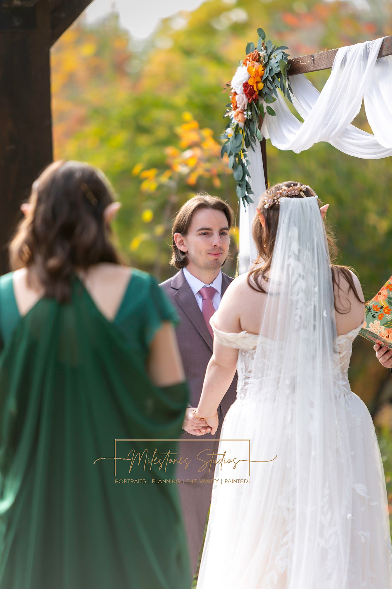 Image from behind bride looking at groom saying vows