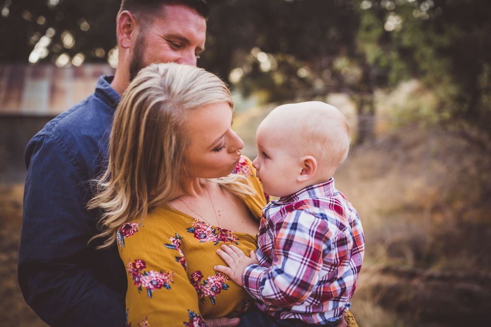 A sequence of family photos showing embraces and tender moments outdoors during a sunset photoshoot.