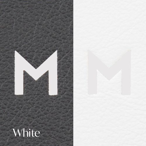 Letter M logo displayed in white color against dark leather texture with white background comparison.