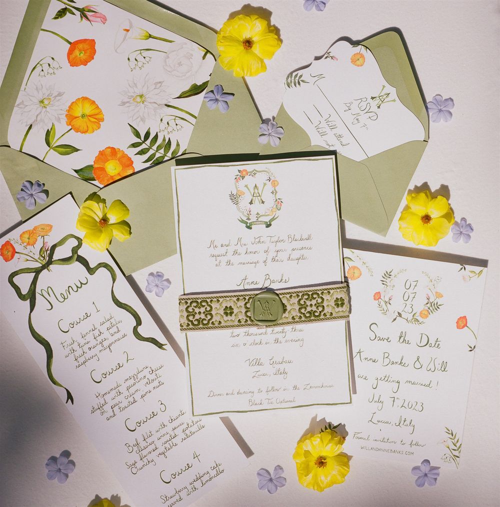 Elegant wedding invitation suite with yellow daffodils and floral motifs on pale green envelopes and stationery.