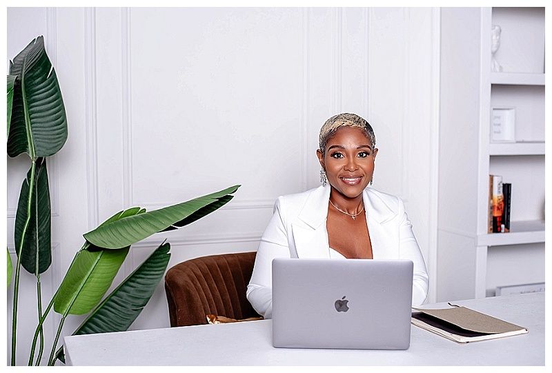 Personal branding image of a woman working on her computer in a bright West Palm Beach office for social media content.